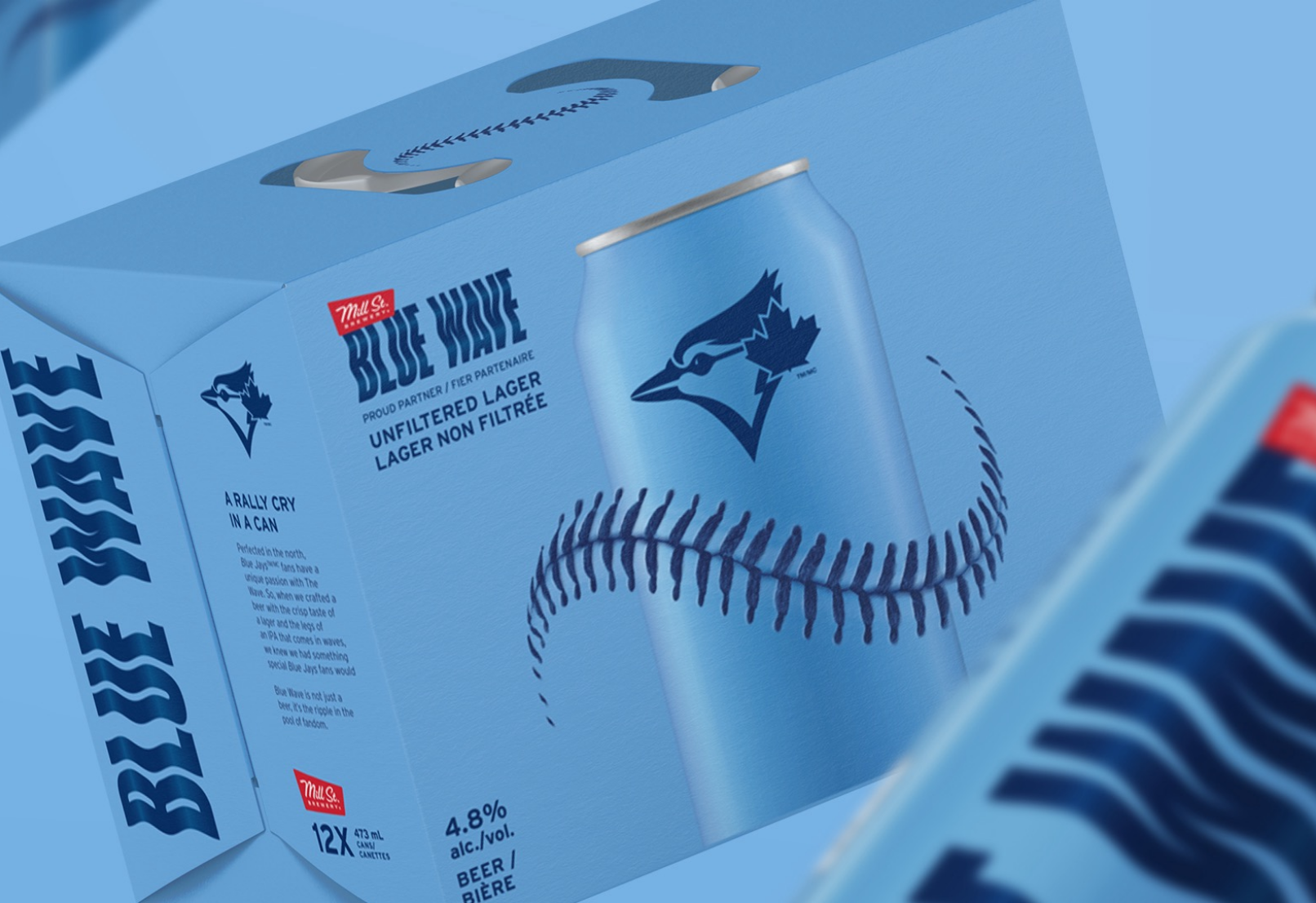 A light blue box with a blue jay logo containing cans of "Blue Wave" unfiltered lager.