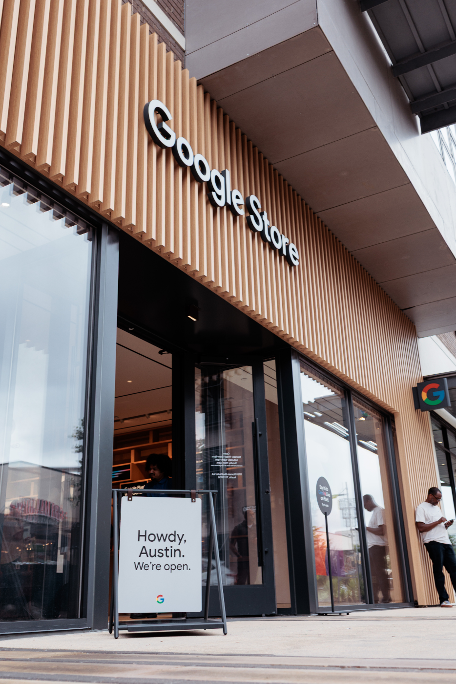 Exterior of a Google Store in Austin with a sign saying "Howdy, Austin. We're open."