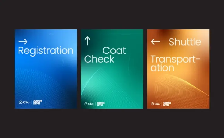 Three colorful signs with arrows indicate directions for registration, coat check, and shuttle transportation.