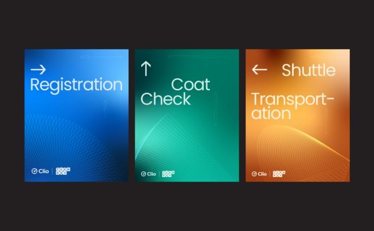 Three colorful signs with arrows indicate directions for registration, coat check, and shuttle transportation.